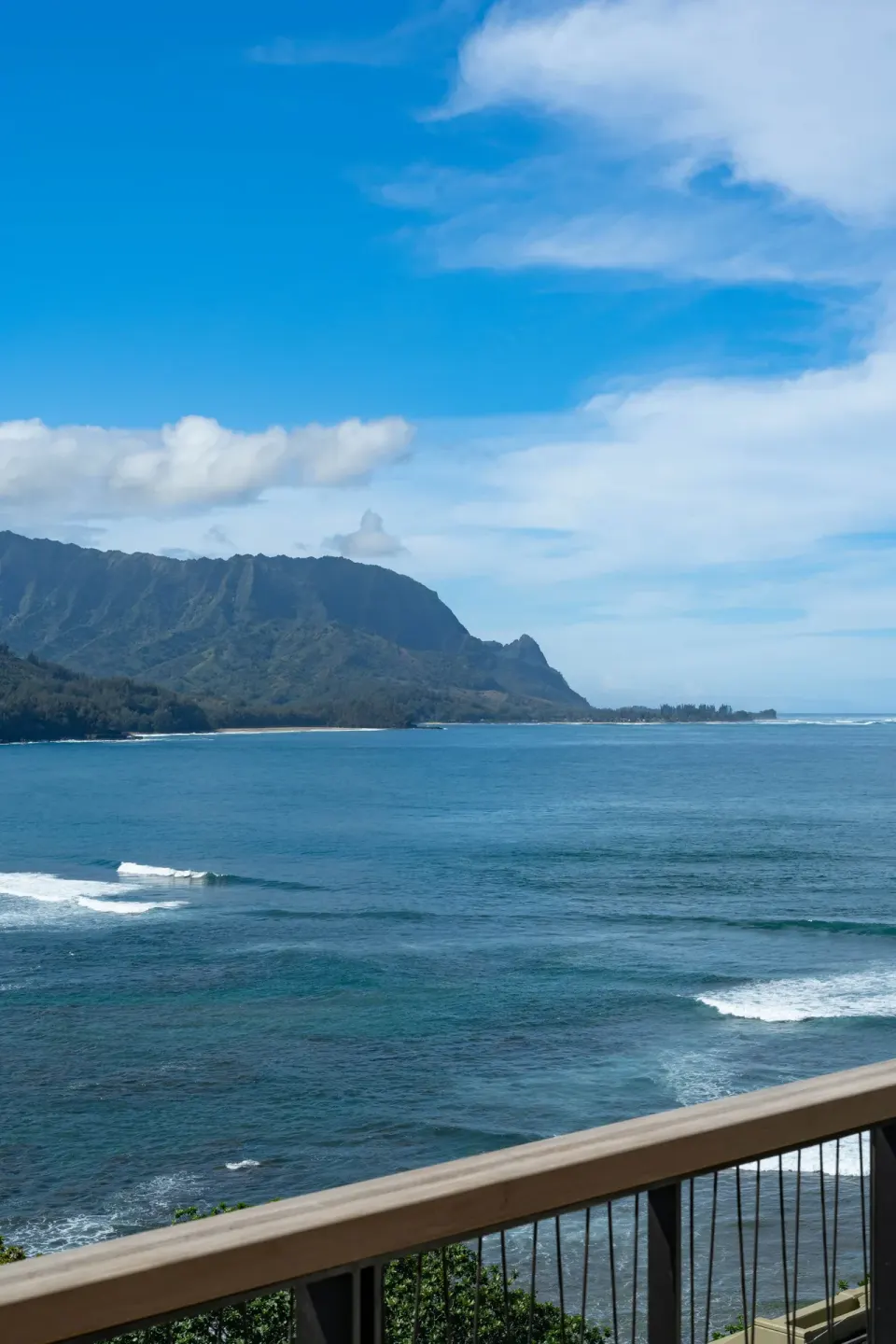 Ocean and mountain view from a balcony railing at 1 Hotel Hanalei Bay.