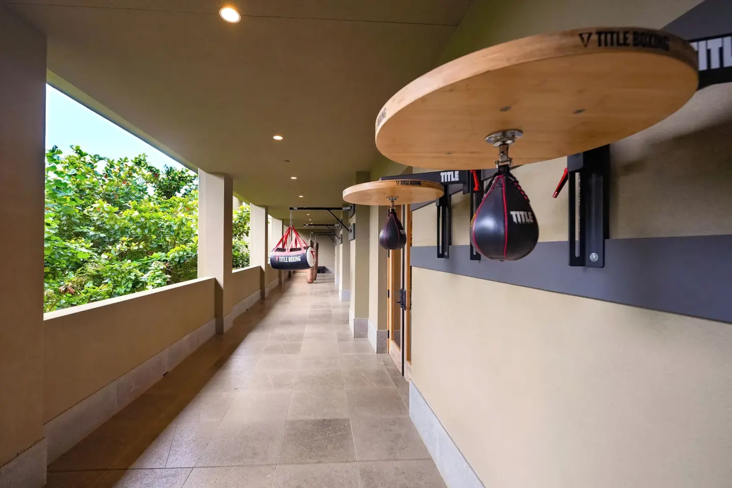 Covered outdoor training corridor with boxing equipment at 1 Hotel Hanalei Bay.