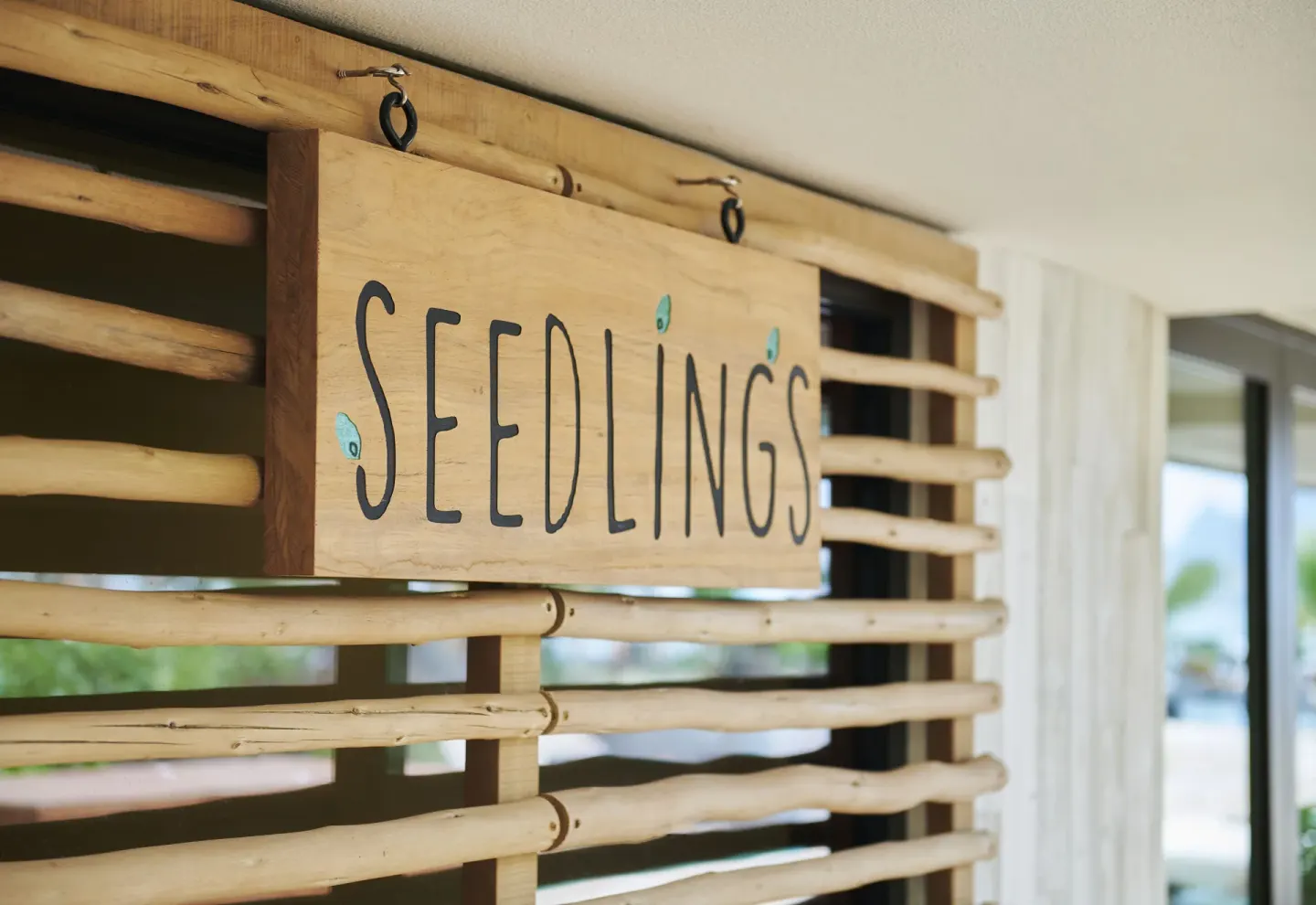 Seedlings sign on a bamboo wall at 1 Hotel Hanalei Bay.