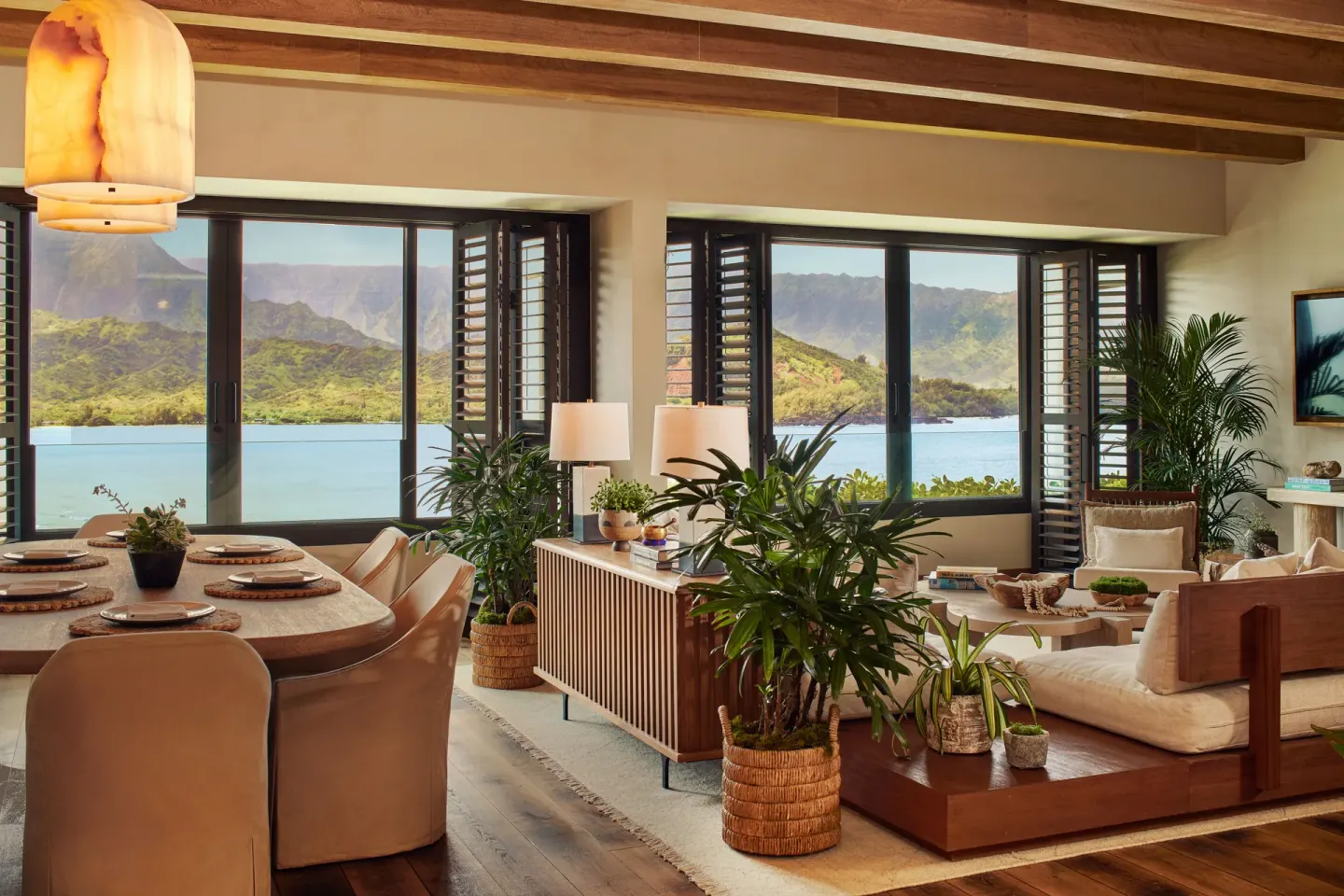 Suite living and dining area with bay and mountain views at 1 Hotel Hanalei Bay.