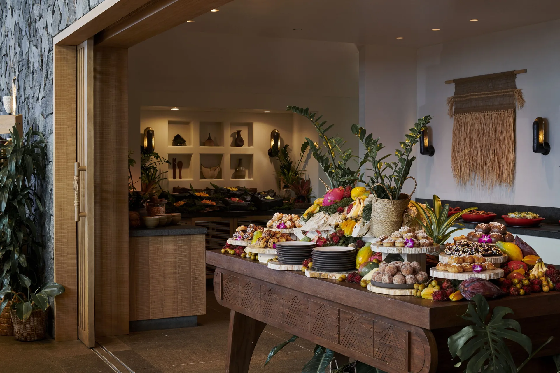 Buffet table with tropical fruit and pastries at 1 Hotel Hanalei Bay.