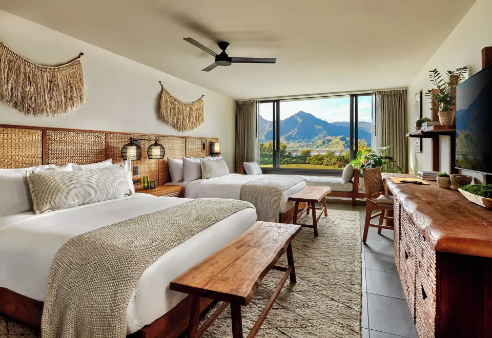 Mountain View 2 Queens room with two beds, wood furnishings and mountain scenery at 1 Hotel Hanalei Bay.