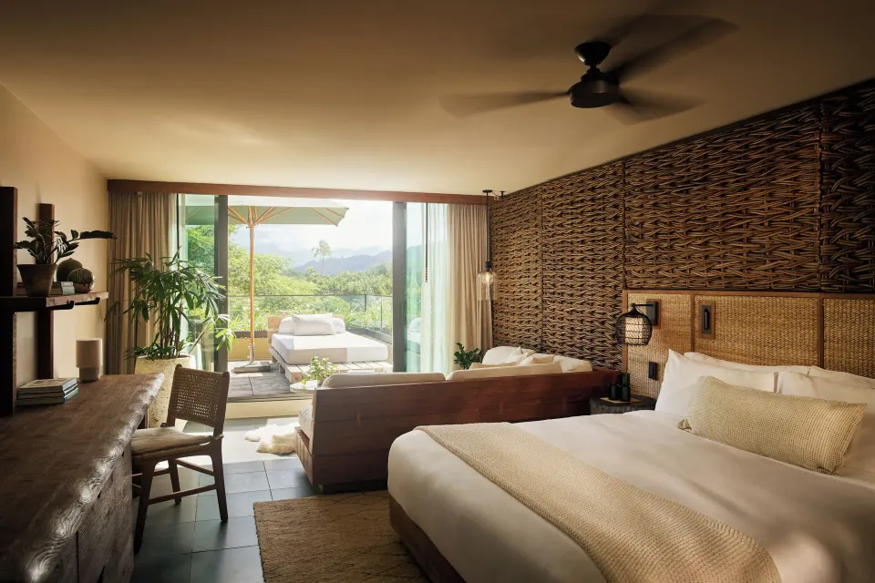 Mountain View Terrace guest room with king bed and open lanai at 1 Hotel Hanalei Bay.