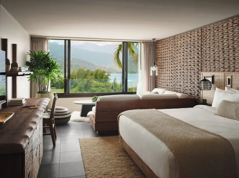 Mountain View king bed guest room with sitting area and mountain bay view at 1 Hotel Hanalei Bay.
