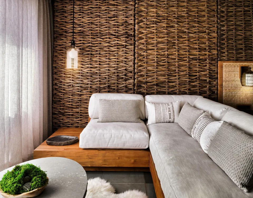 Mountain View guest room lounge with sectional seating and woven wall at 1 Hotel Hanalei Bay.
