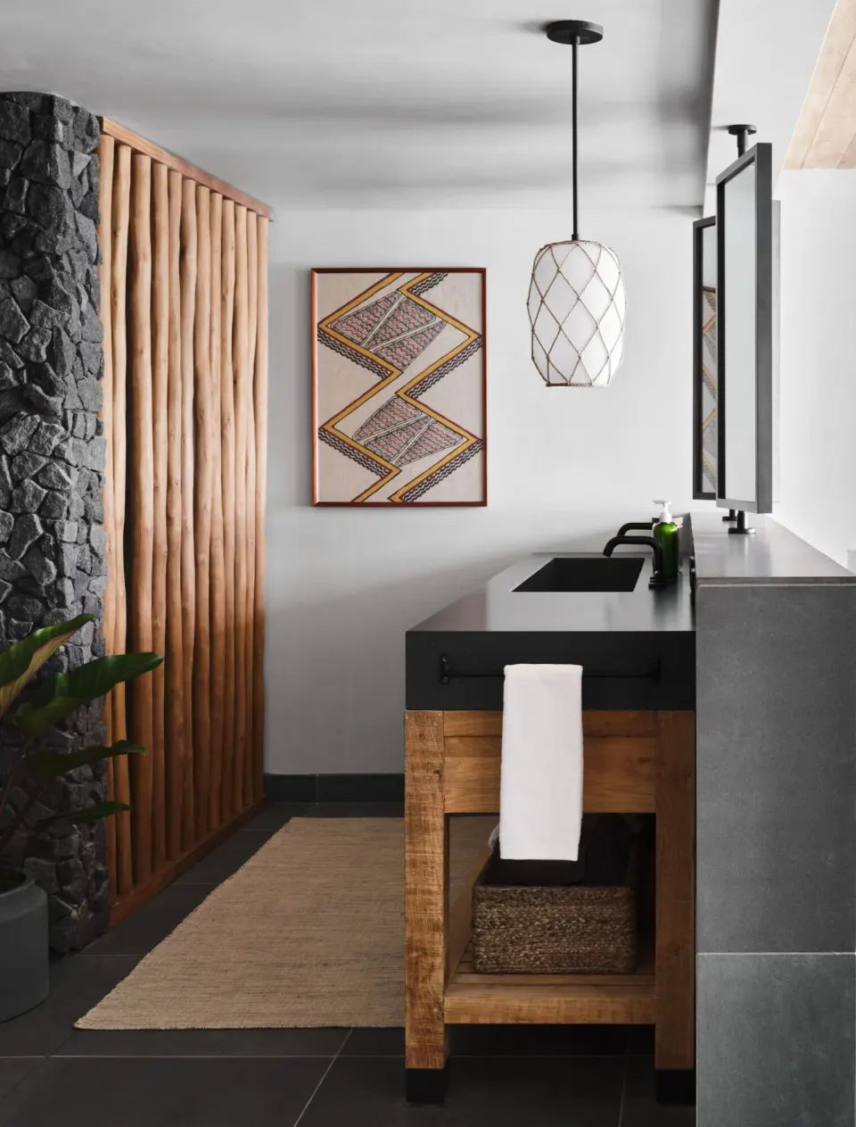 Ocean View 1 Bedroom Suite bathroom vanity with wood screen at 1 Hotel Hanalei Bay.