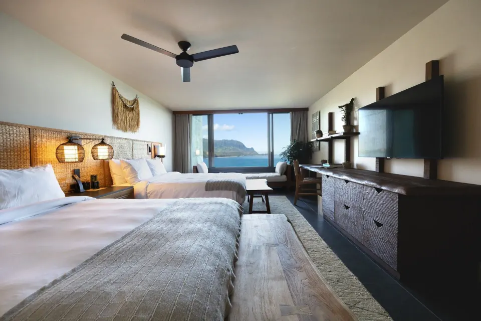 Ocean View 2 Queens guest room with two beds and bay view at 1 Hotel Hanalei Bay.