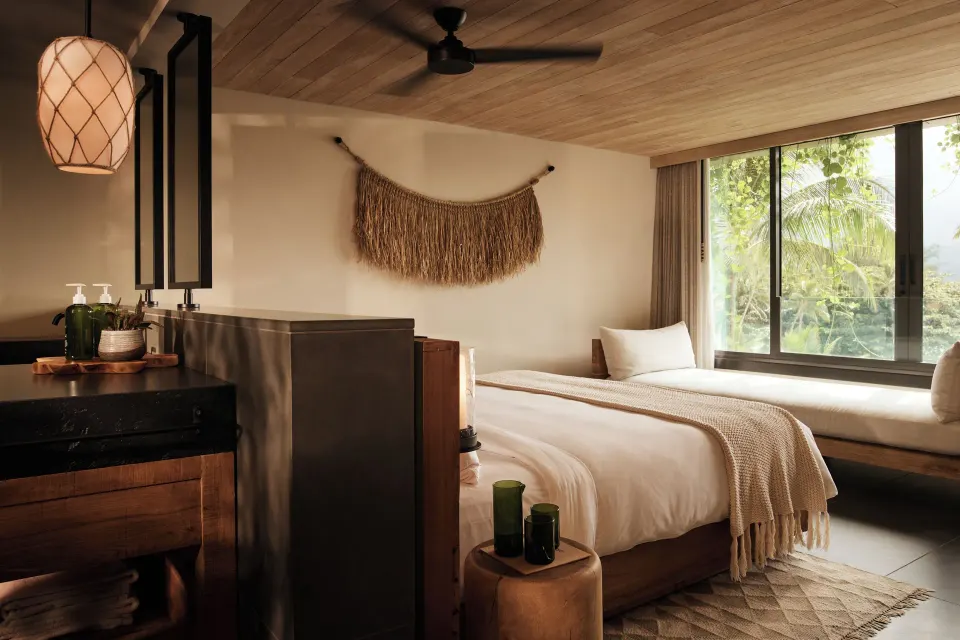 Ocean View Lounge guest room with bed, daybed, and vanity area at 1 Hotel Hanalei Bay.