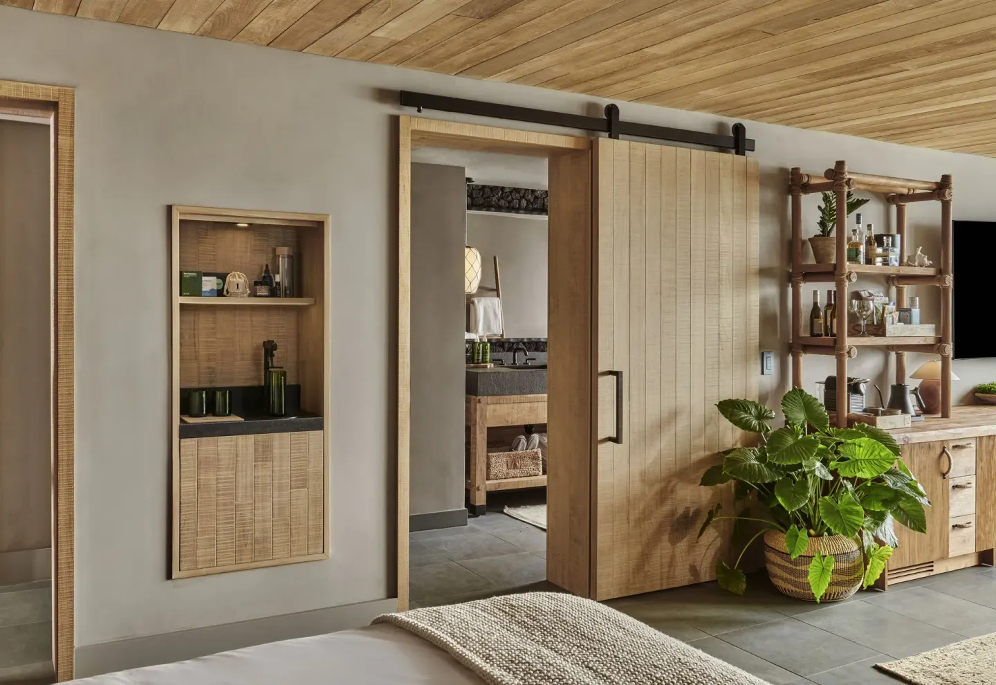 Ocean View Studio Suite bedroom entry with sliding bath door at 1 Hotel Hanalei Bay.