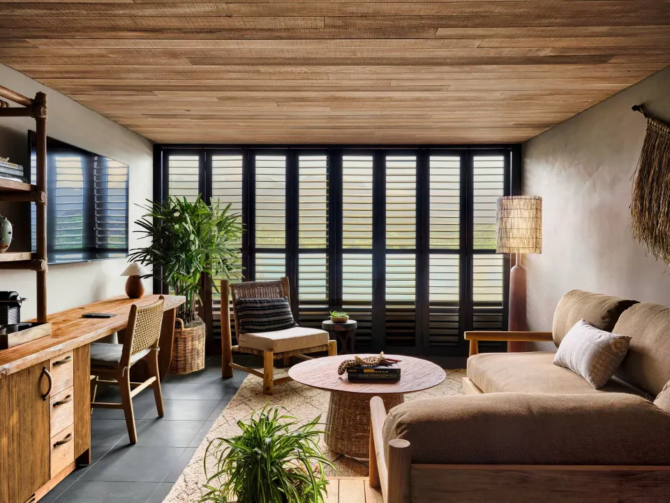 Ocean View Studio Suite lounge with shutters and desk at 1 Hotel Hanalei Bay.