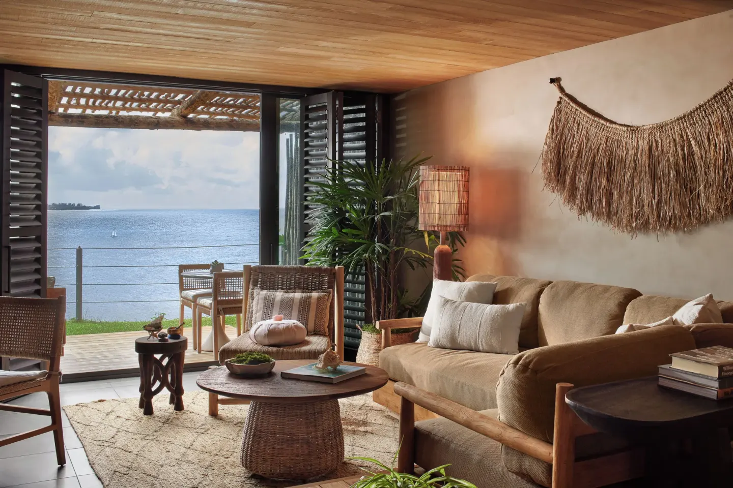 Ocean-facing lounge and terrace in an Ocean View Terrace Studio Suite at 1 Hotel Hanalei Bay.