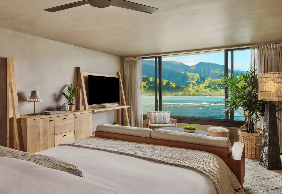Ocean View guest room with king bed and bay windows at 1 Hotel Hanalei Bay.
