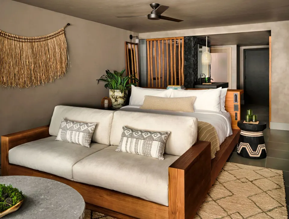 Panoramic Ocean View guest room with king bed and sofa at 1 Hotel Hanalei Bay.
