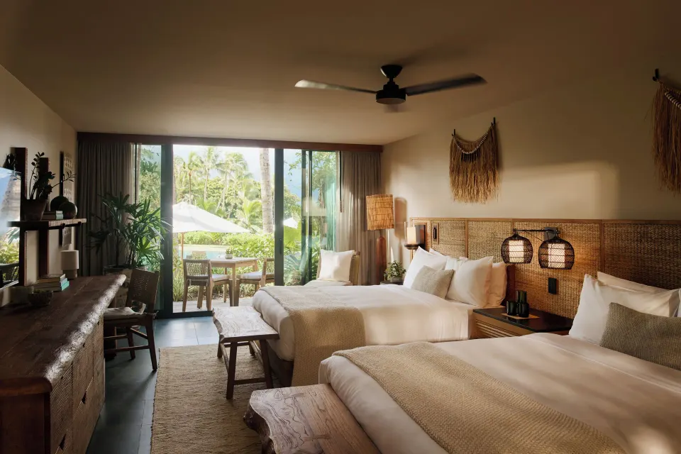 Pool View Terrace room with two beds and sliding doors to the terrace at 1 Hotel Hanalei Bay.