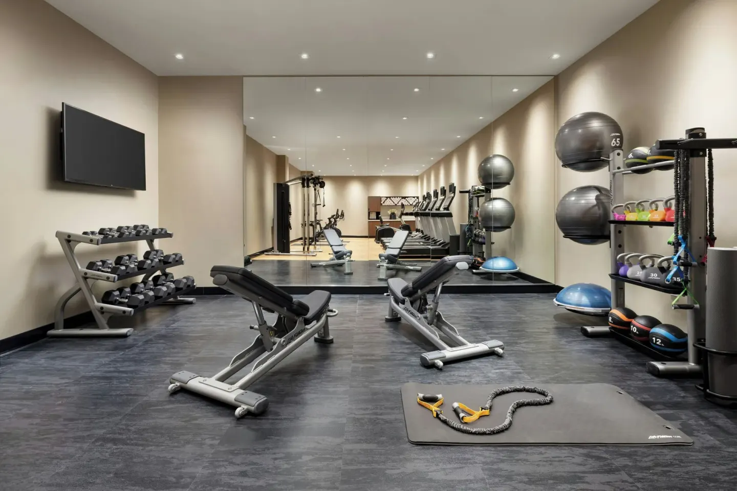 Fitness center weights, benches and exercise accessories at AC Hotel Honolulu.