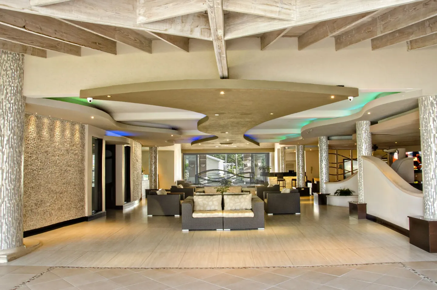 Open lobby seating area with sculpted ceilings at Accra Beach Hotel & Spa.