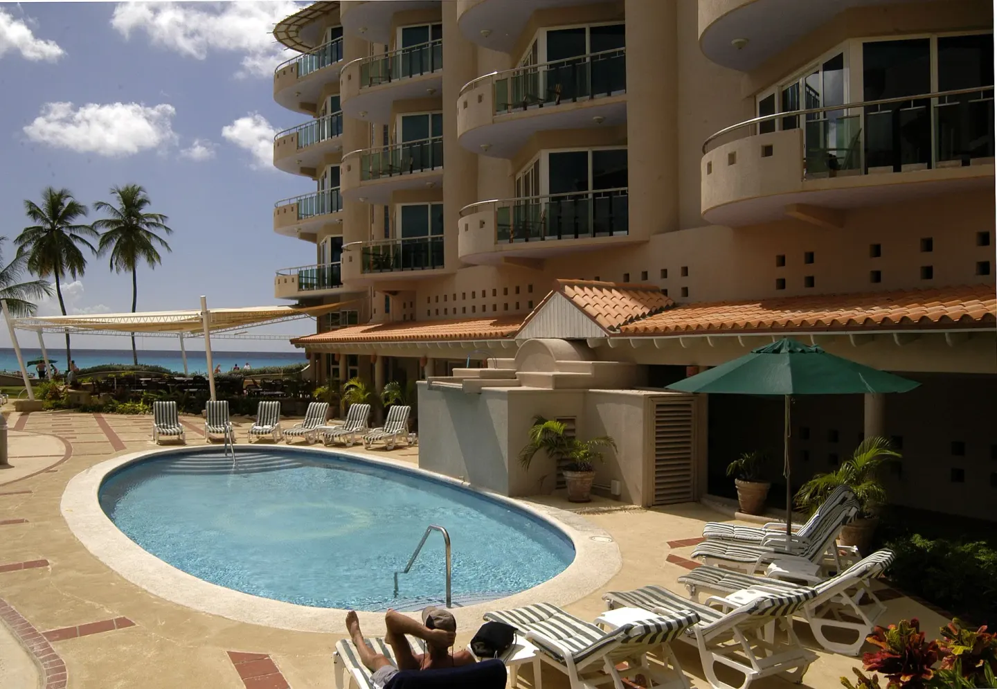 Small pool with loungers beside the hotel building at Accra Beach Hotel & Spa.