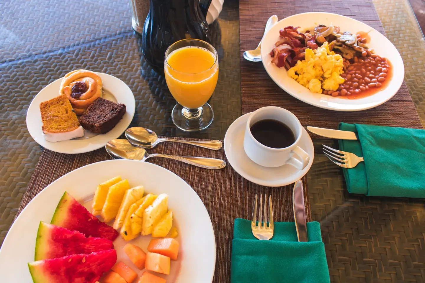 Breakfast plates with fruit, pastries, coffee, and hot items at Accra Beach Hotel & Spa.