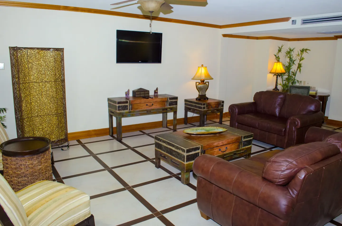 Deluxe Junior Suite sitting area with leather sofas at Accra Beach Hotel & Spa.