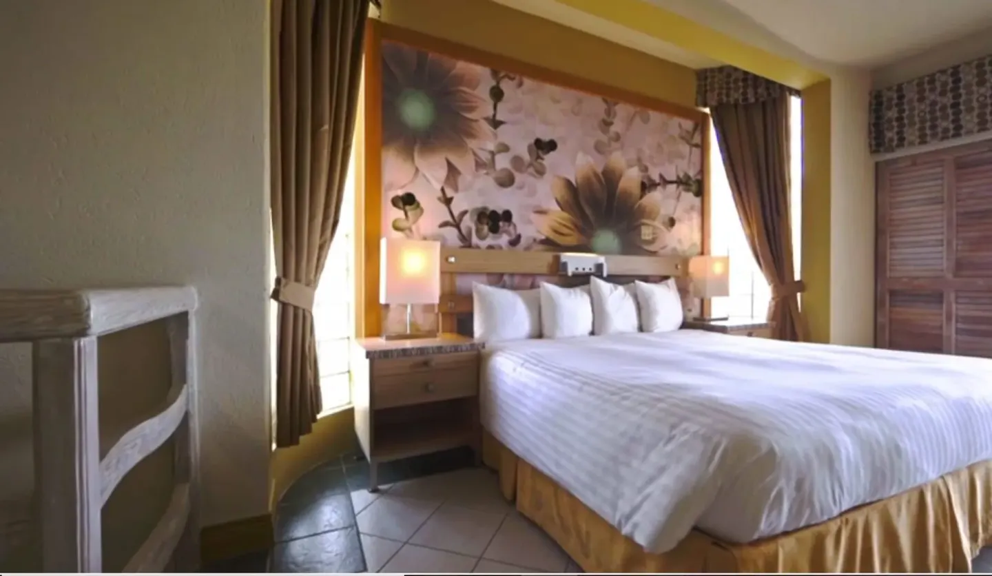 Duplex penthouse bedroom with king bed at Accra Beach Hotel & Spa.