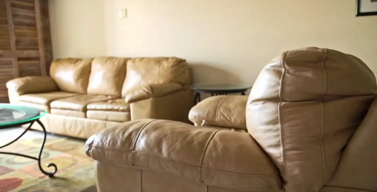 Duplex penthouse living area with tan seating at Accra Beach Hotel & Spa.