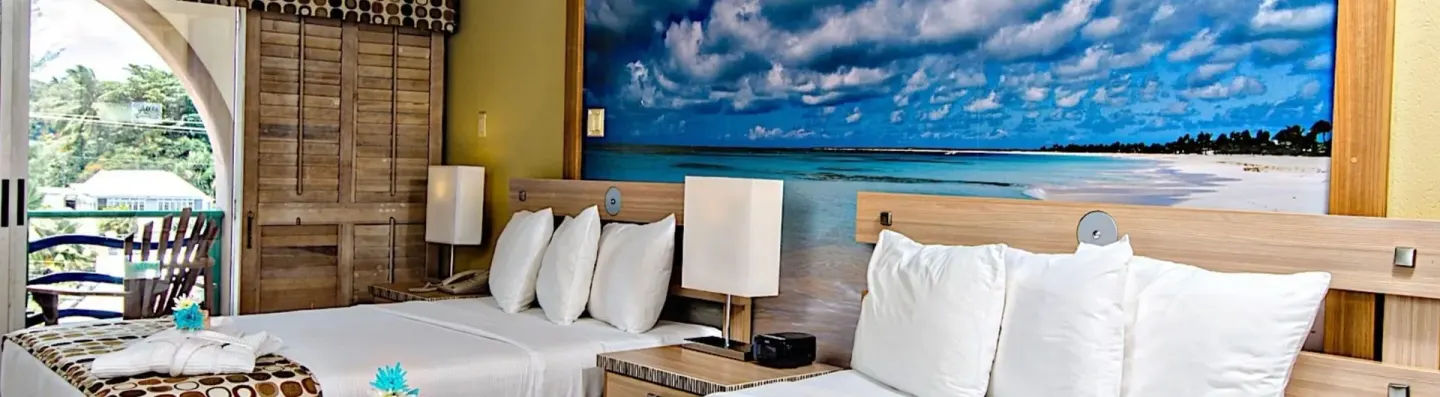 Island View Room with two beds, beach mural and balcony at Accra Beach Hotel & Spa.