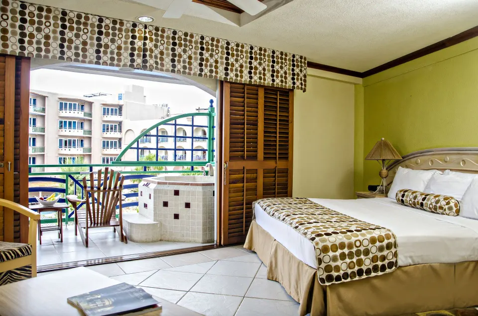 Ocean Front Room with bed and balcony at Accra Beach Hotel & Spa.