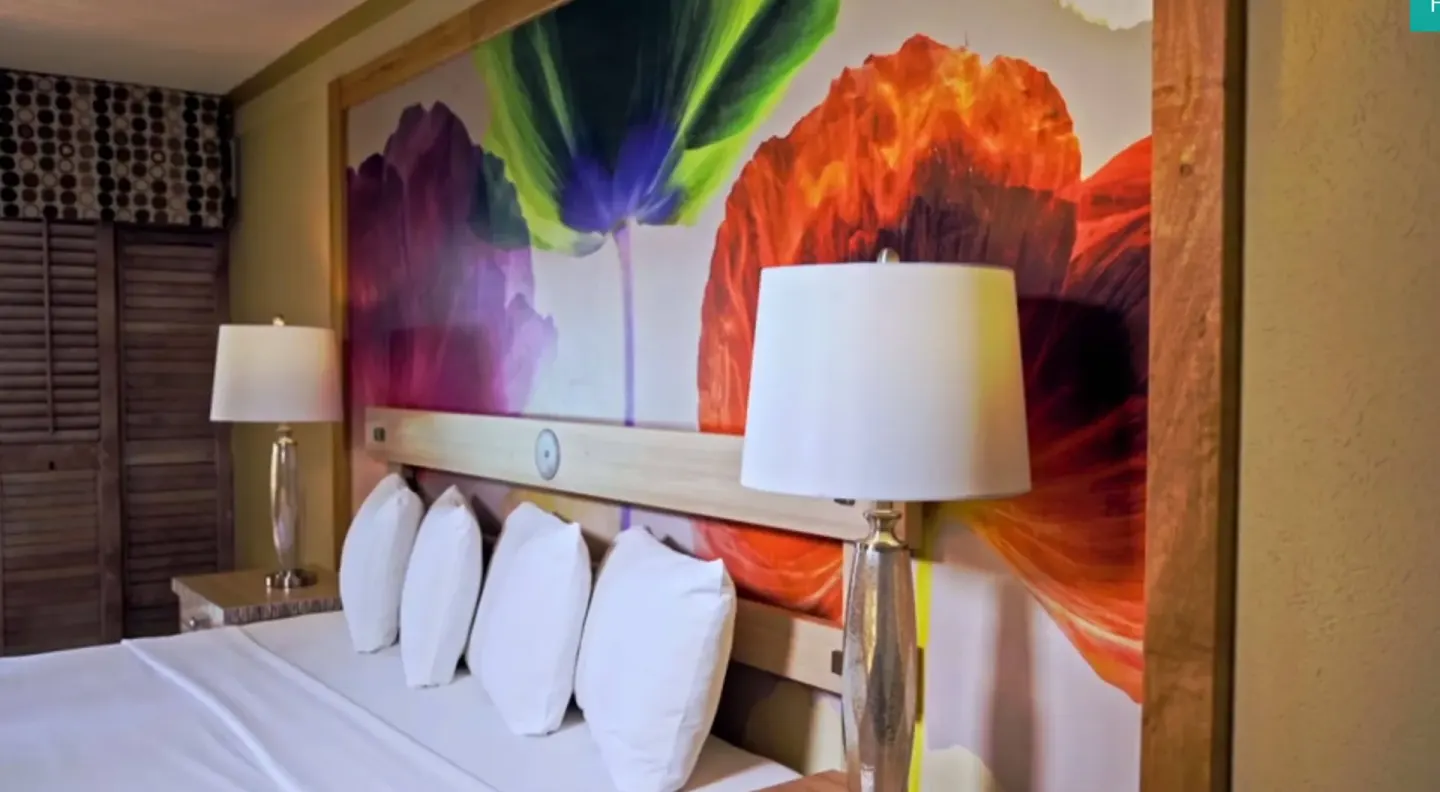 Close view of an Island View bed and floral mural at Accra Beach Hotel & Spa.