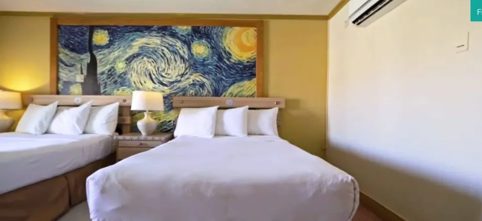 Island View room with two beds and starry mural at Accra Beach Hotel & Spa.