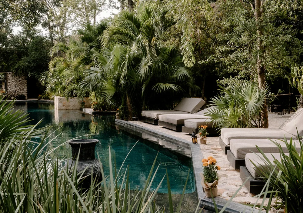 Hotel Bardo adults-only design-focused boutique hotel with private plunge pools and lush garden pathways in Tulum, Mexico.