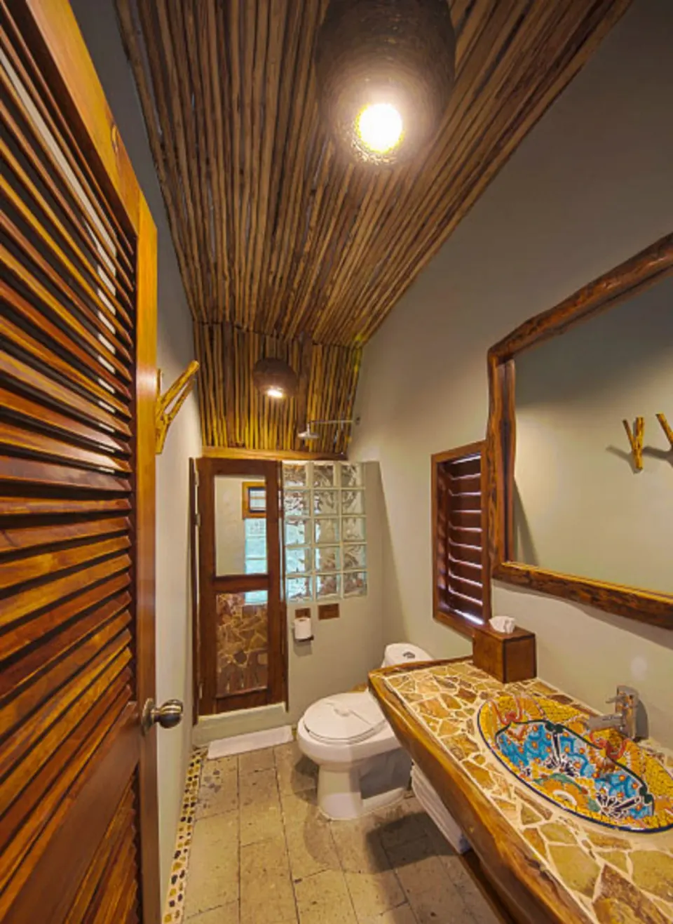 Bathroom with decorative sink and wooden ceiling in a Junior Suite at Ahau Tulum