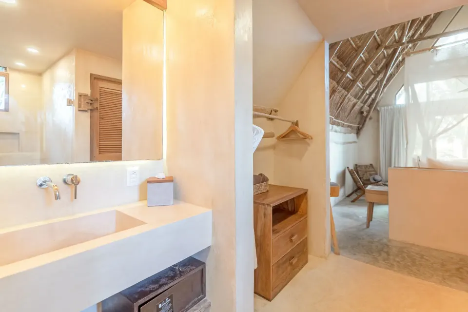 Bathroom and entry area of a Junior Suite Oceanfront Top Level at Ahau Tulum