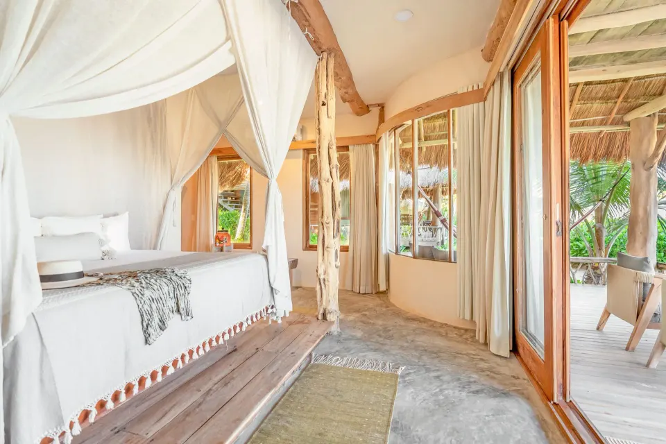 View down the suite's entrance corridor to the terrace from the Master Suite Oceanfront Beach Level at Ahau Tulum