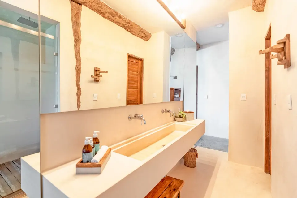 Master Suite Oceanfront Beach level sink counter with rustic beams at Ahau Tulum