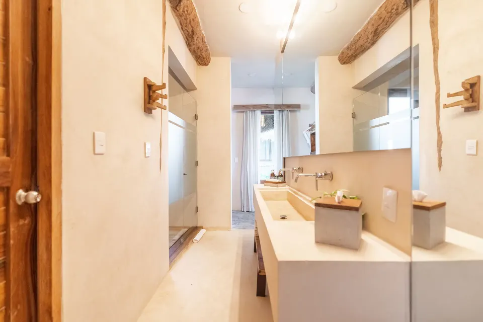 Master Suite Oceanfront Beach level bathroom vanity and mirror at Ahau Tulum