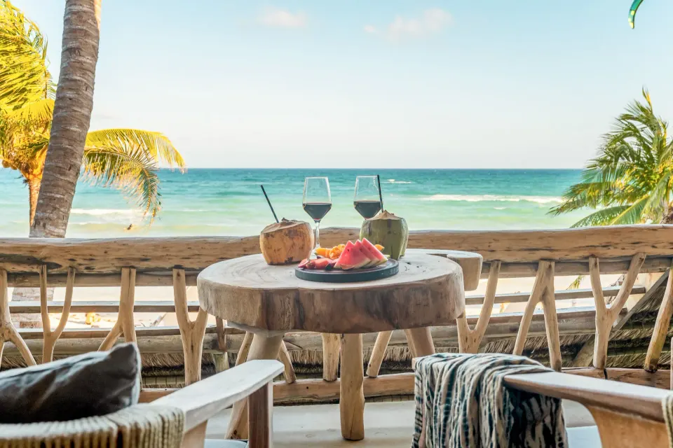 Table with fresh fruit, coconuts and wine on the Master Suite balcony at Ahau Tulum