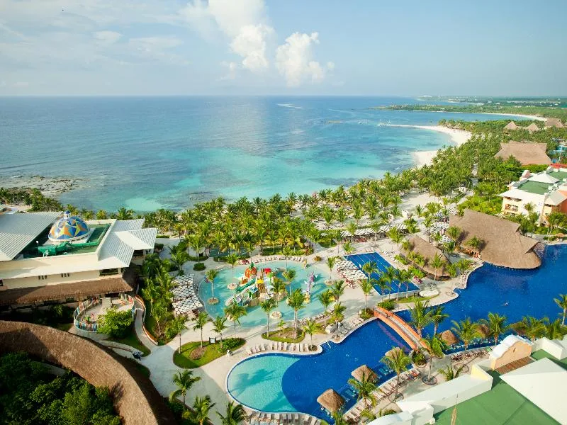 Barcelo Maya Palace upscale all-inclusive resort with large beachfront pool and Riviera Maya resort complex setting in Mexico.