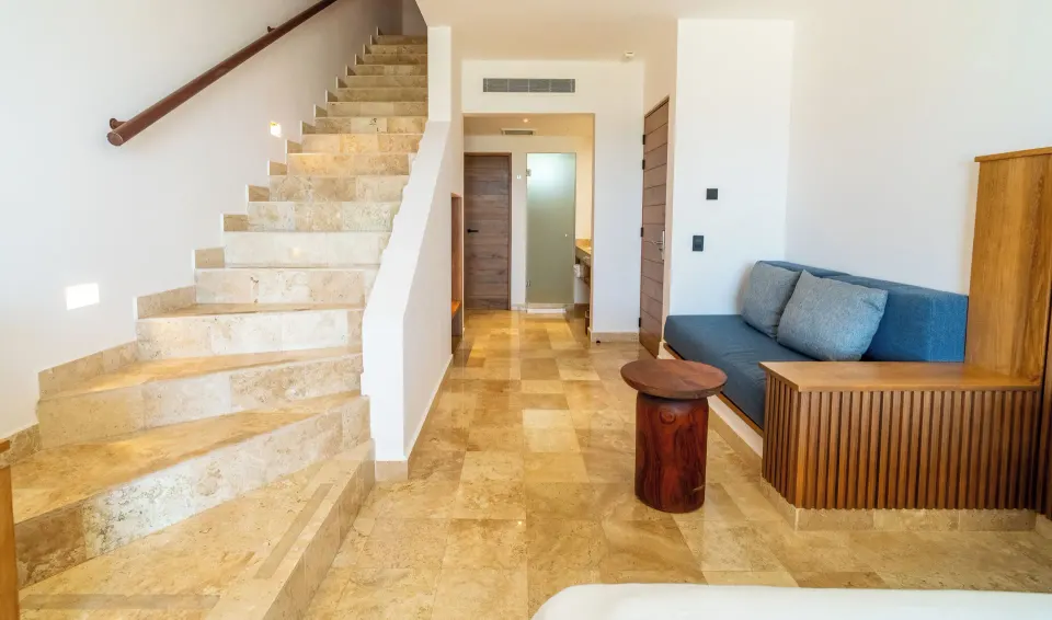 Entryway and staircase inside Junior Suite Penthouse at Akumal Bay Beach & Wellness Resort