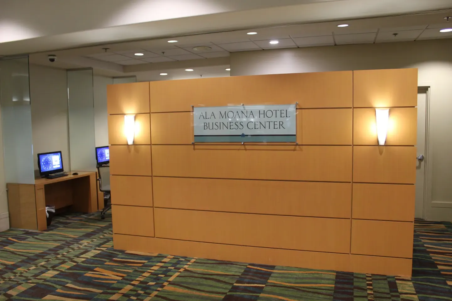Business center sign with computer workstations at Ala Moana Hotel.