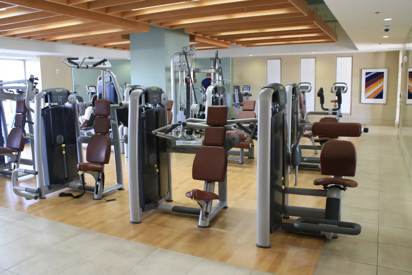 Fitness center with strength machines and cardio equipment at Ala Moana Hotel.