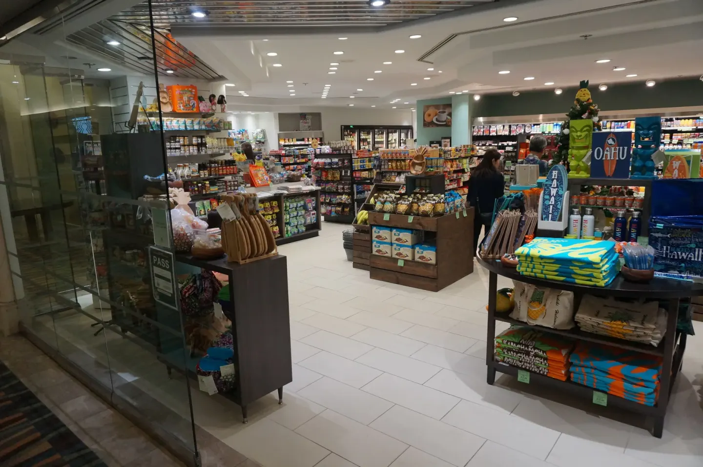 Ala Moana Hotel lobby shop with snacks, drinks, souvenirs, and folded apparel on display.