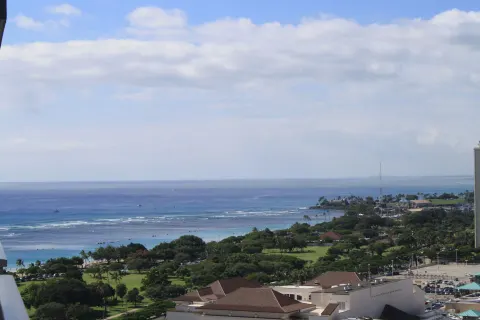 Ocean and park views from Ala Moana Hotel with reef waves and shoreline greenery.