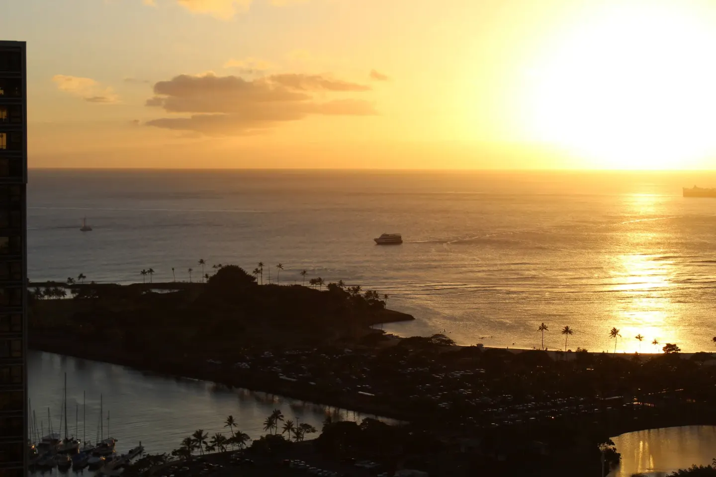 Golden ocean sunset view from the Waikiki Tower at Ala Moana Hotel.