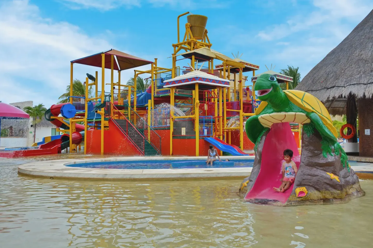 Water park with turtle slide and splash structure at All Ritmo Cancun Resort & Water Park.