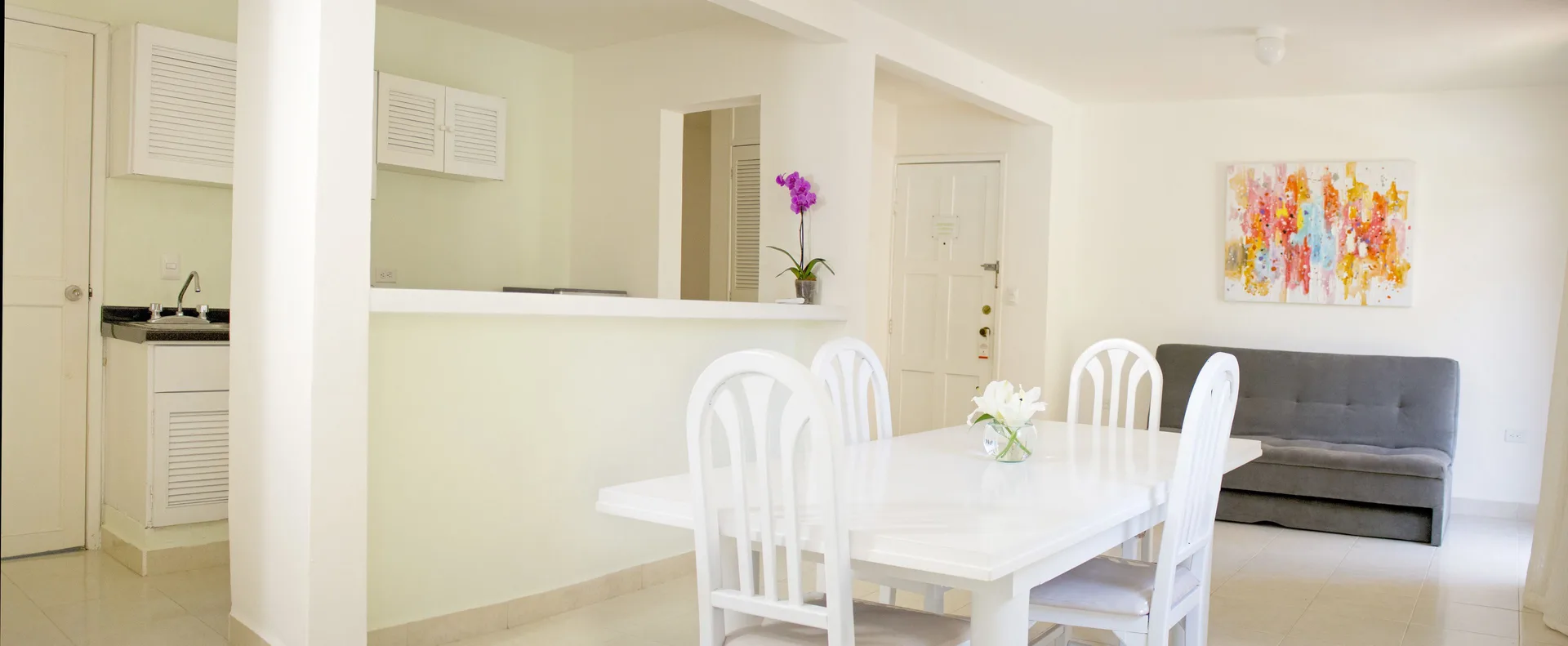 Master Suite Garden View dining area and kitchenette at All Ritmo Cancun Resort & Water Park.