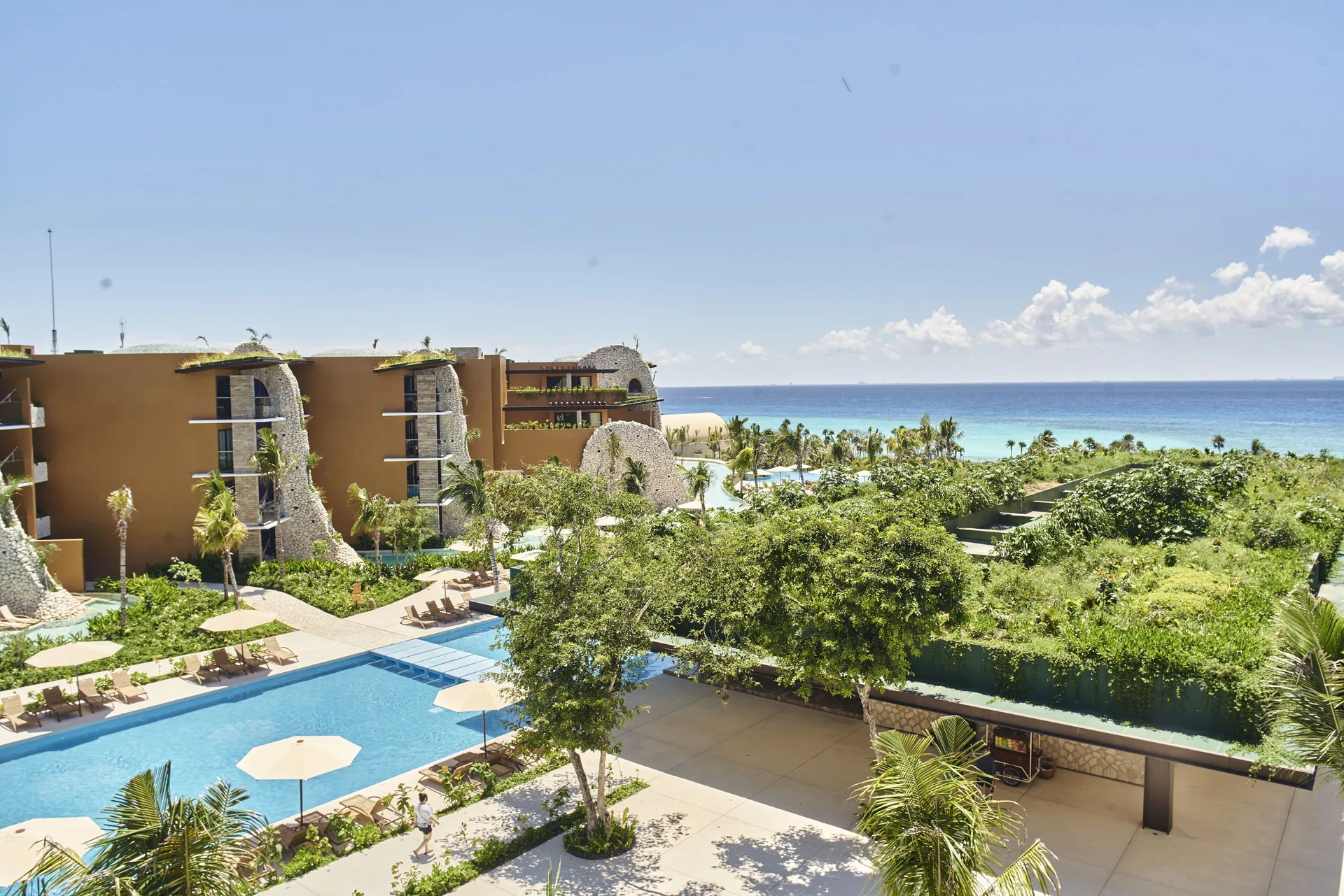 Hotel Xcaret Arte adults-only all-inclusive resort on the Cozumel with artistic architecture, river views, and luxury amenities.
