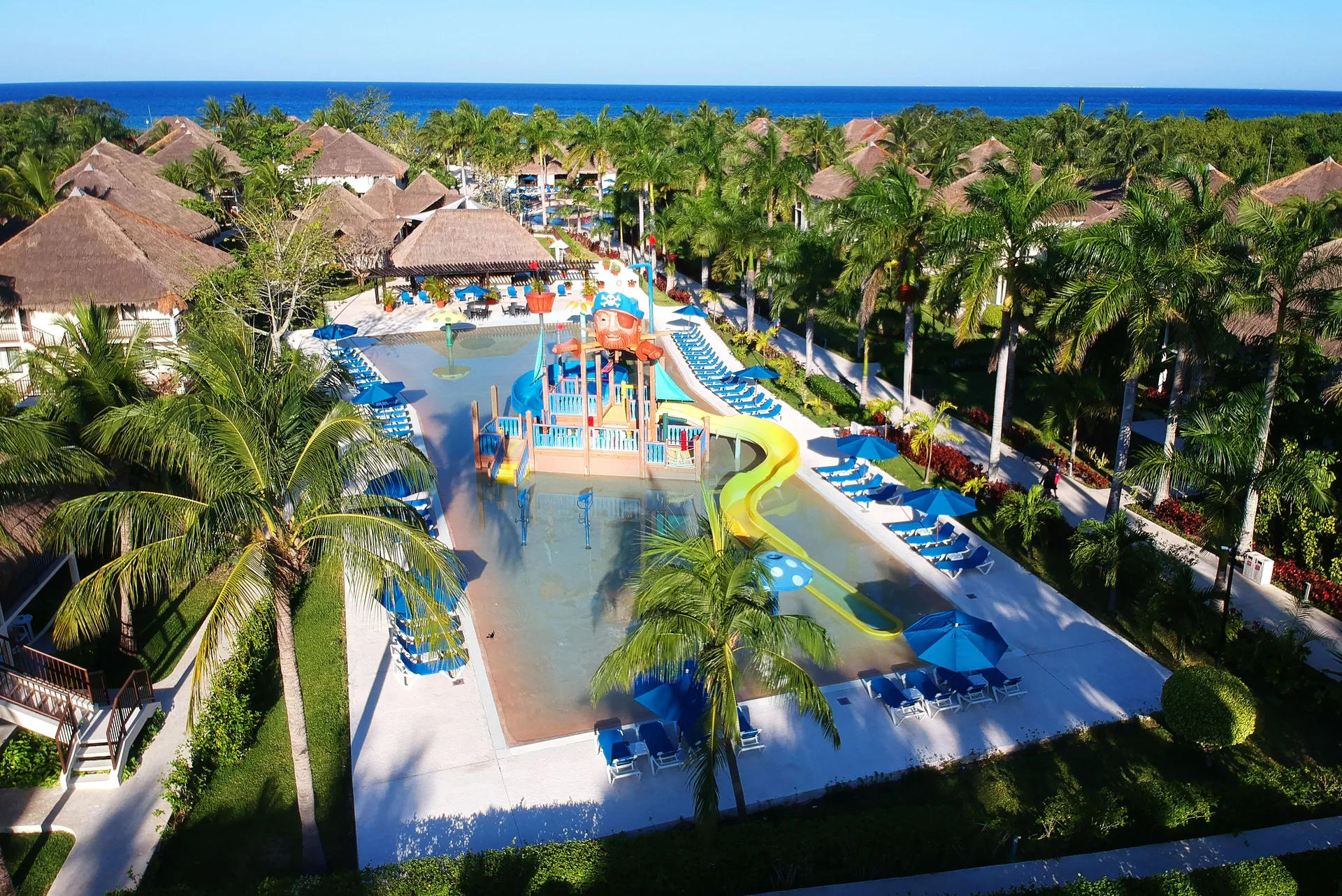 Aerial view of a water play area and resort grounds at Allegro Cozumel.
