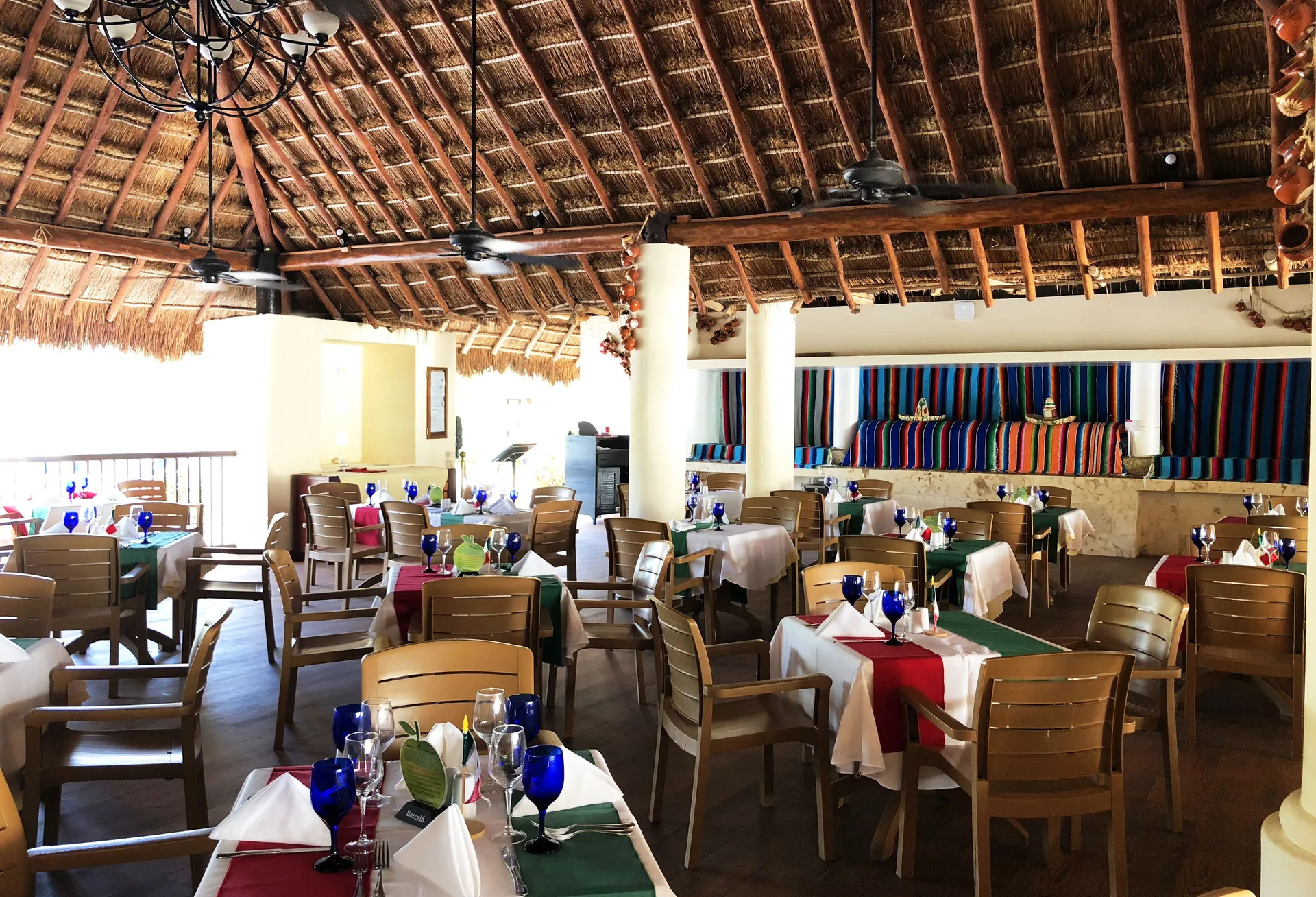 Mexican-themed dining room with colorful textiles at Allegro Cozumel.