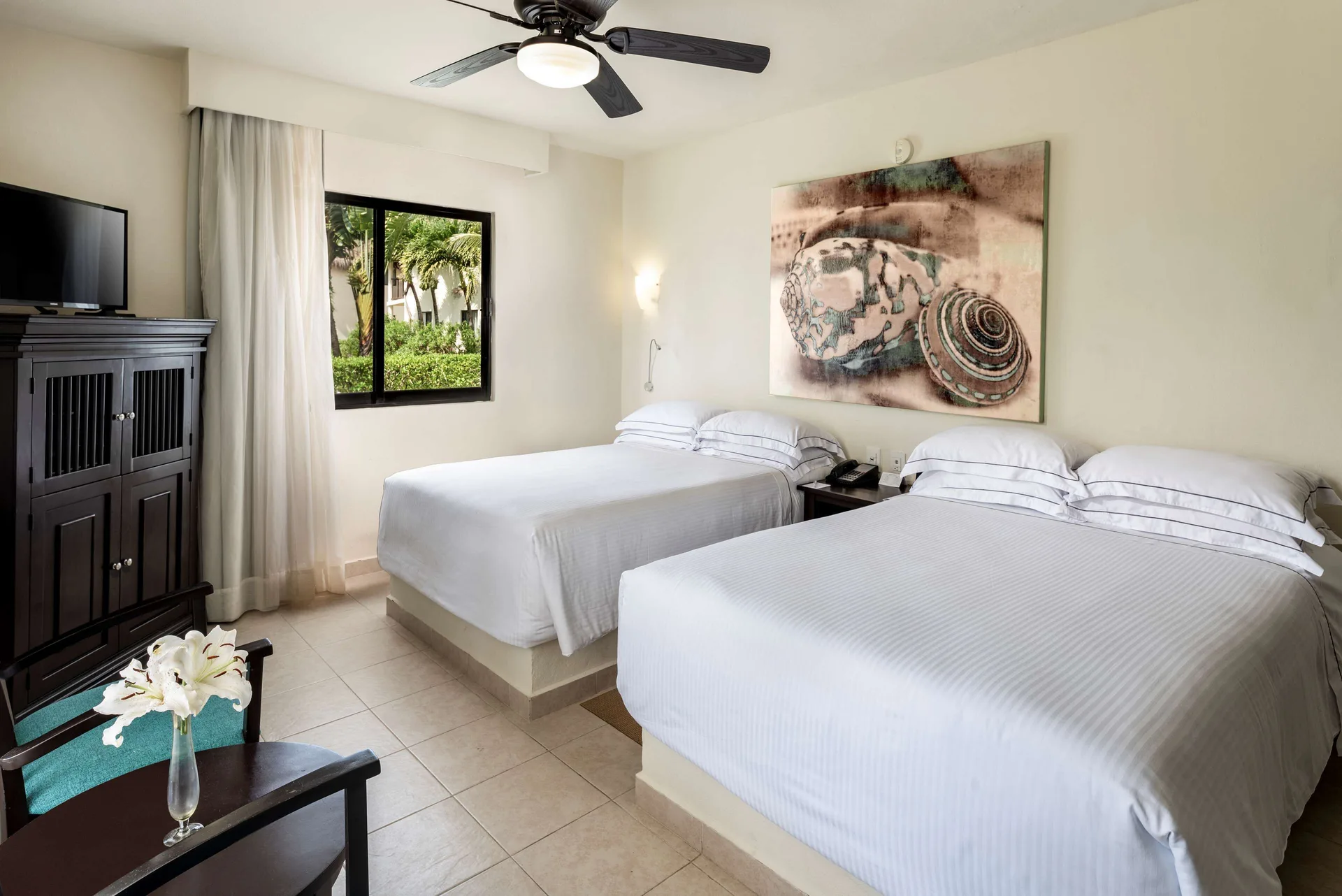 Superior Room with two beds and garden-facing window at Allegro Cozumel.