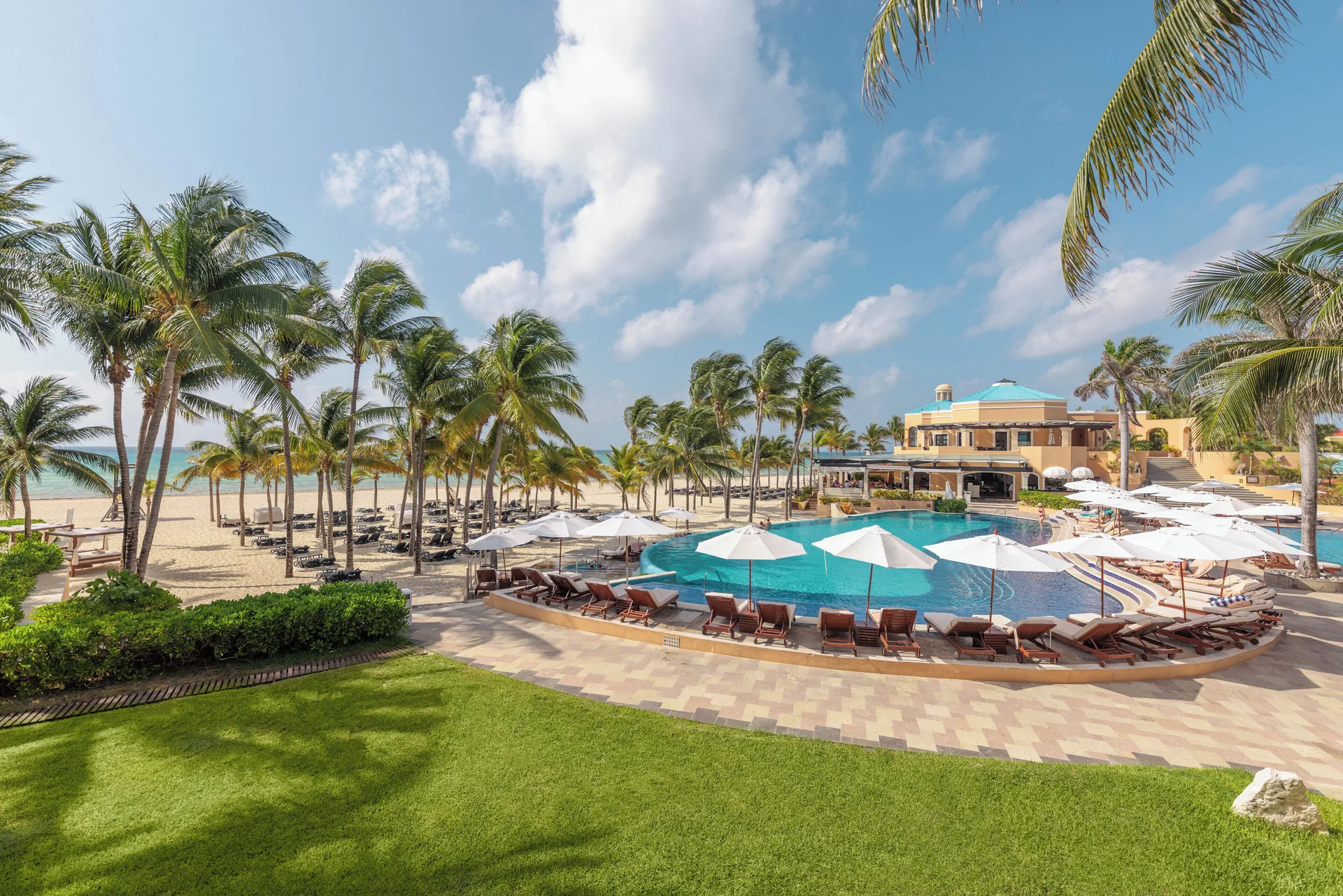 Royal Hideaway Playacar adults-only luxury all-inclusive resort with pristine beach, elegant pools, and upscale dining in Playacar, Mexico.